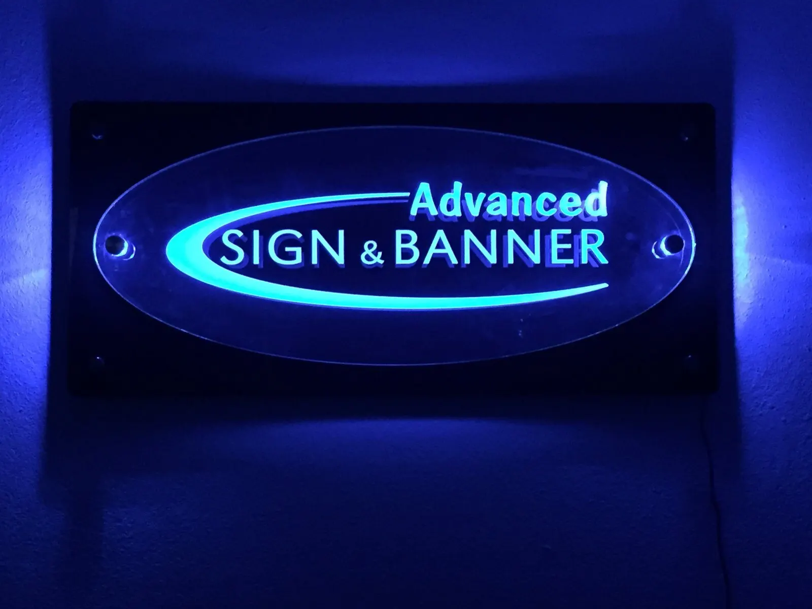 Edge-lit acrylic panel with the Advanced Sign & Banner logo.