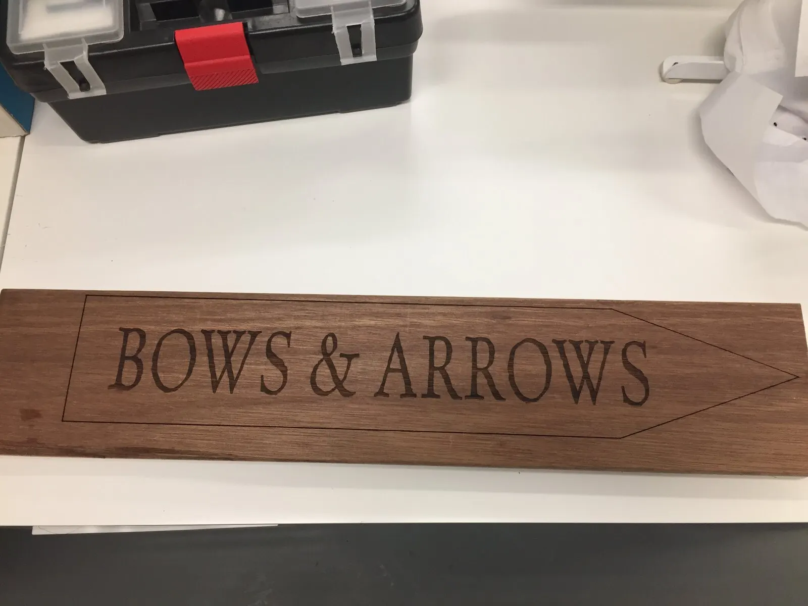 Engraved walnut sign.