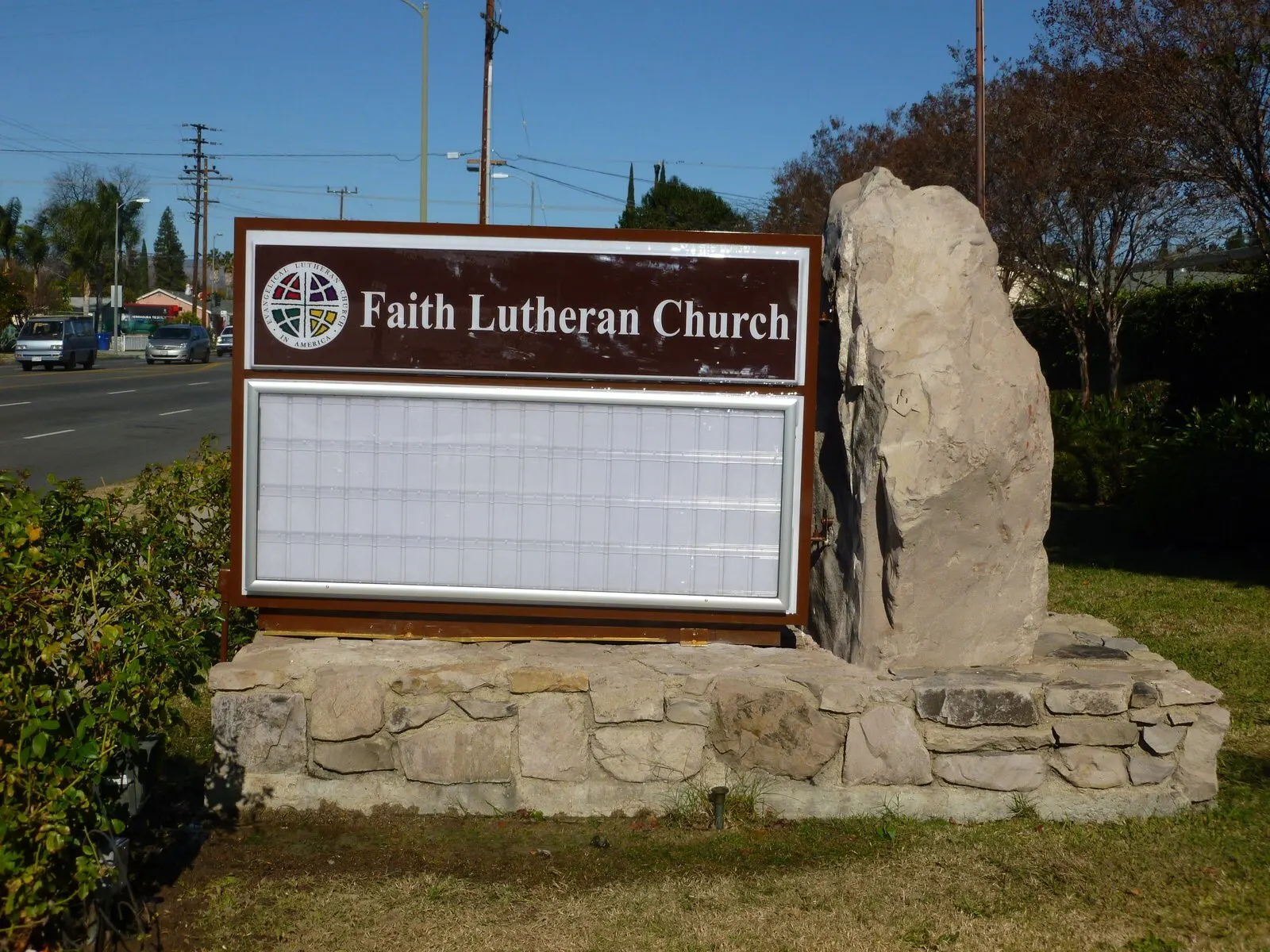 Changeable-letter reader board in a stone monument.