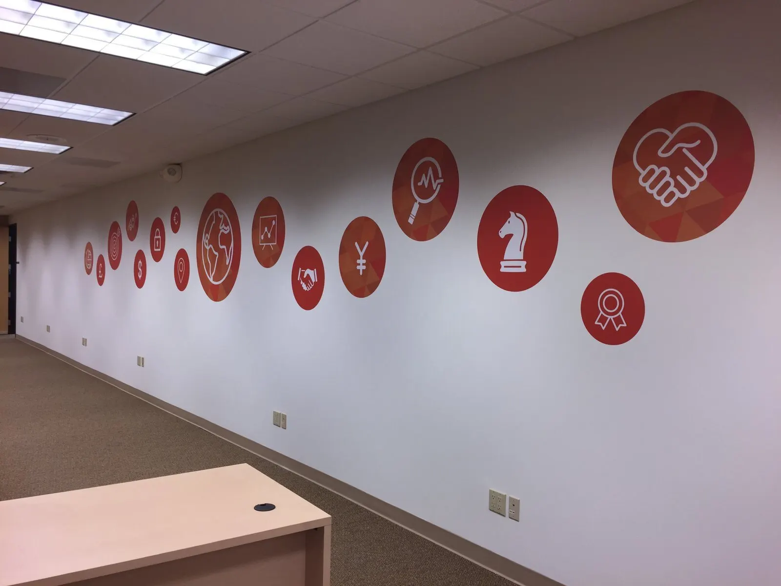 Printed circles along an office corridor.