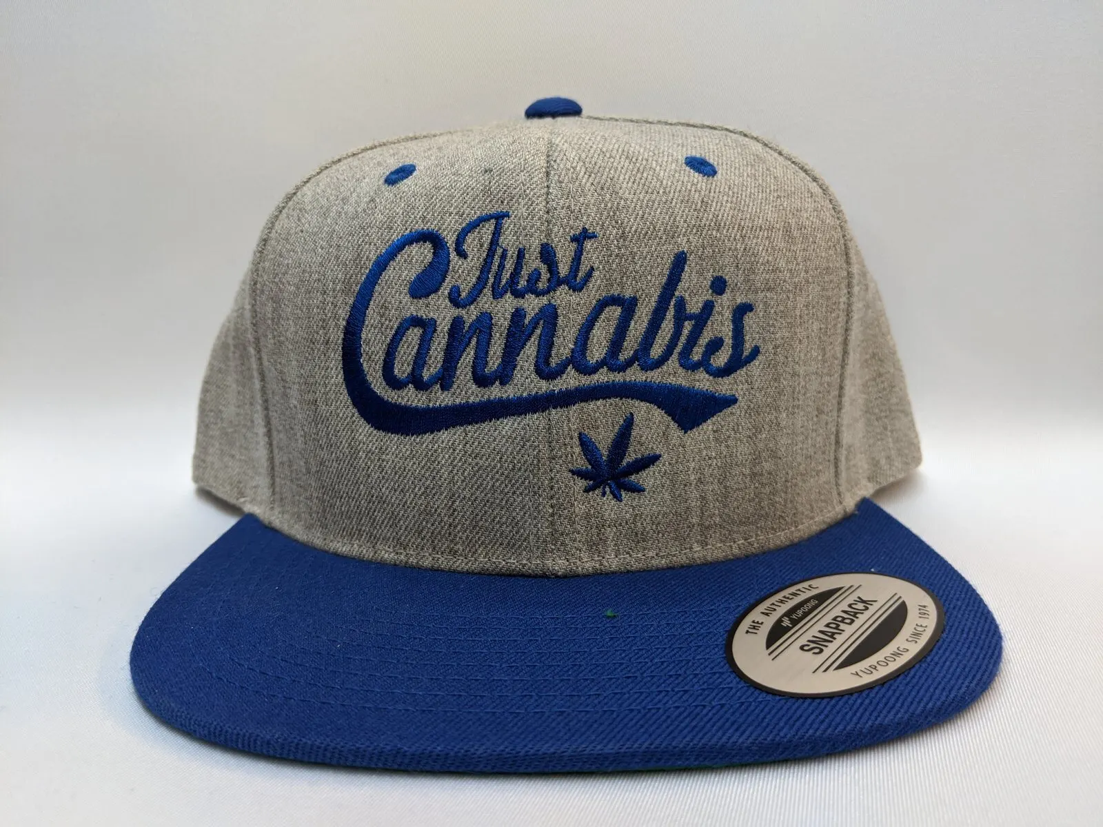 Two-tone snapback with script logo.