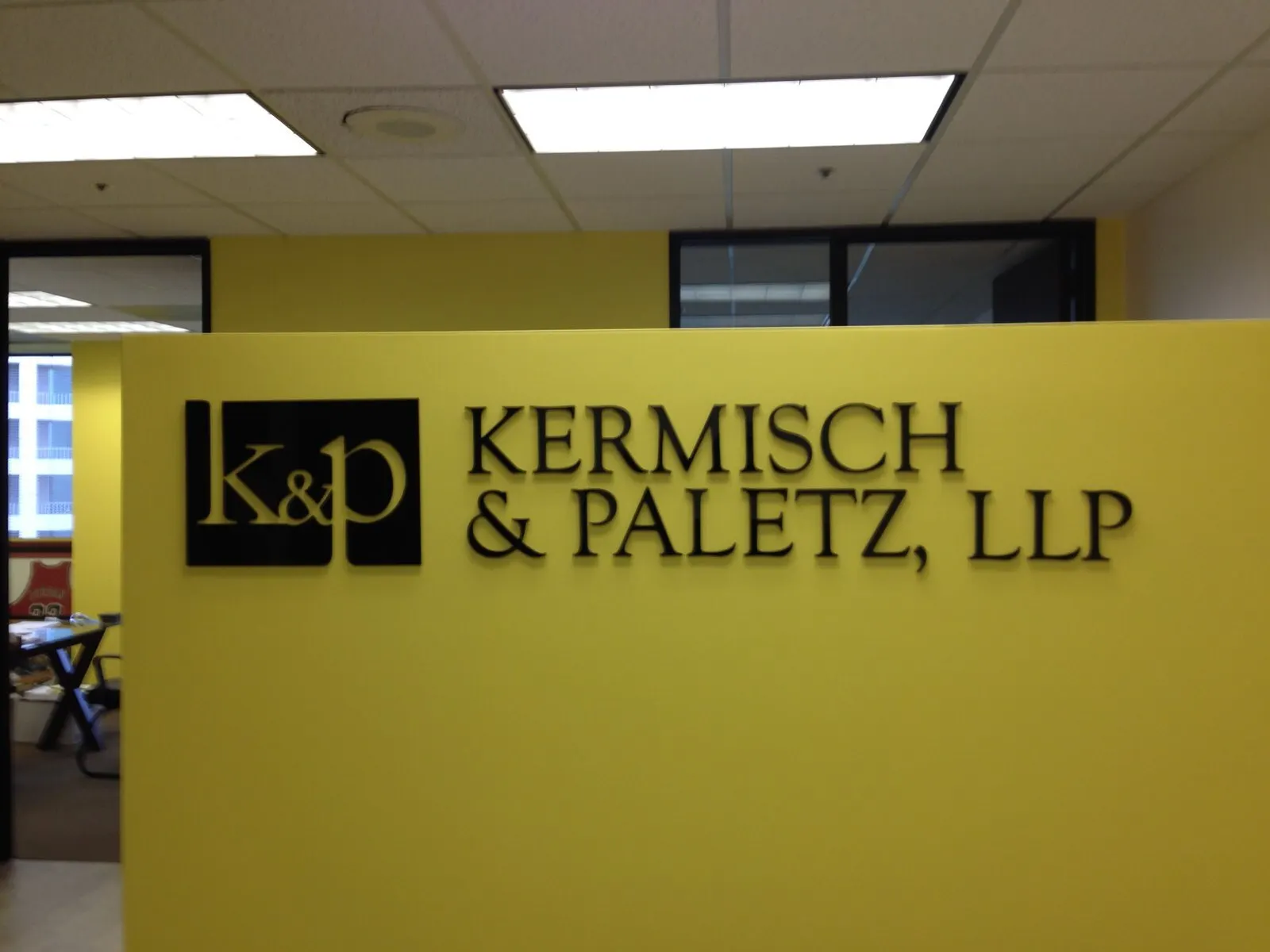 Panel sign with a monogram.