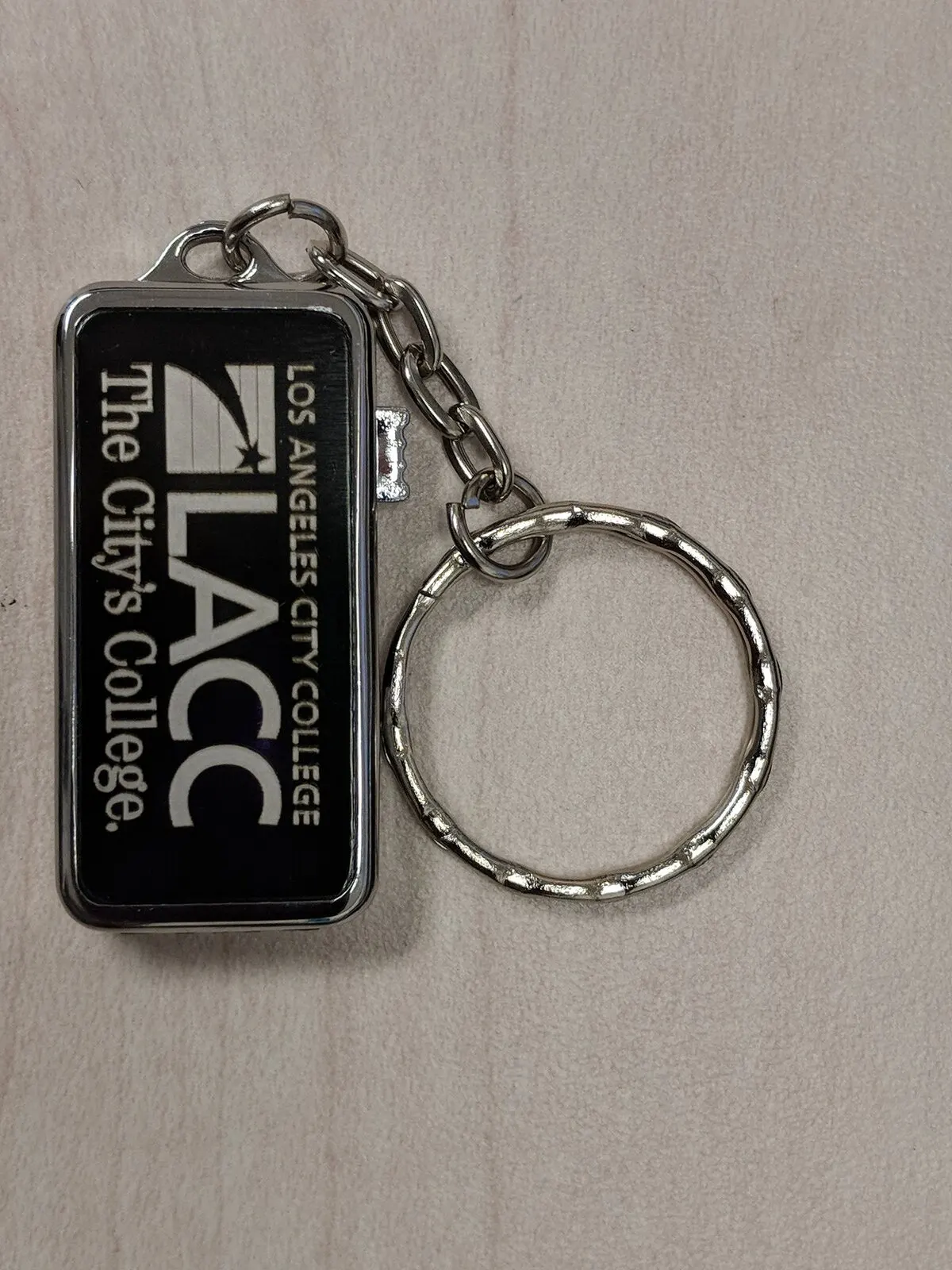 Engraved metal keychain.