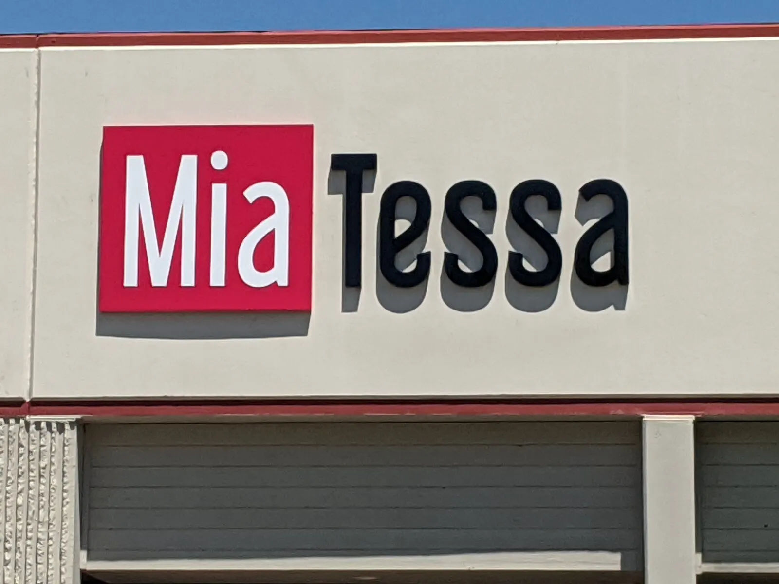 Logo cabinet and letters on the showroom facade.