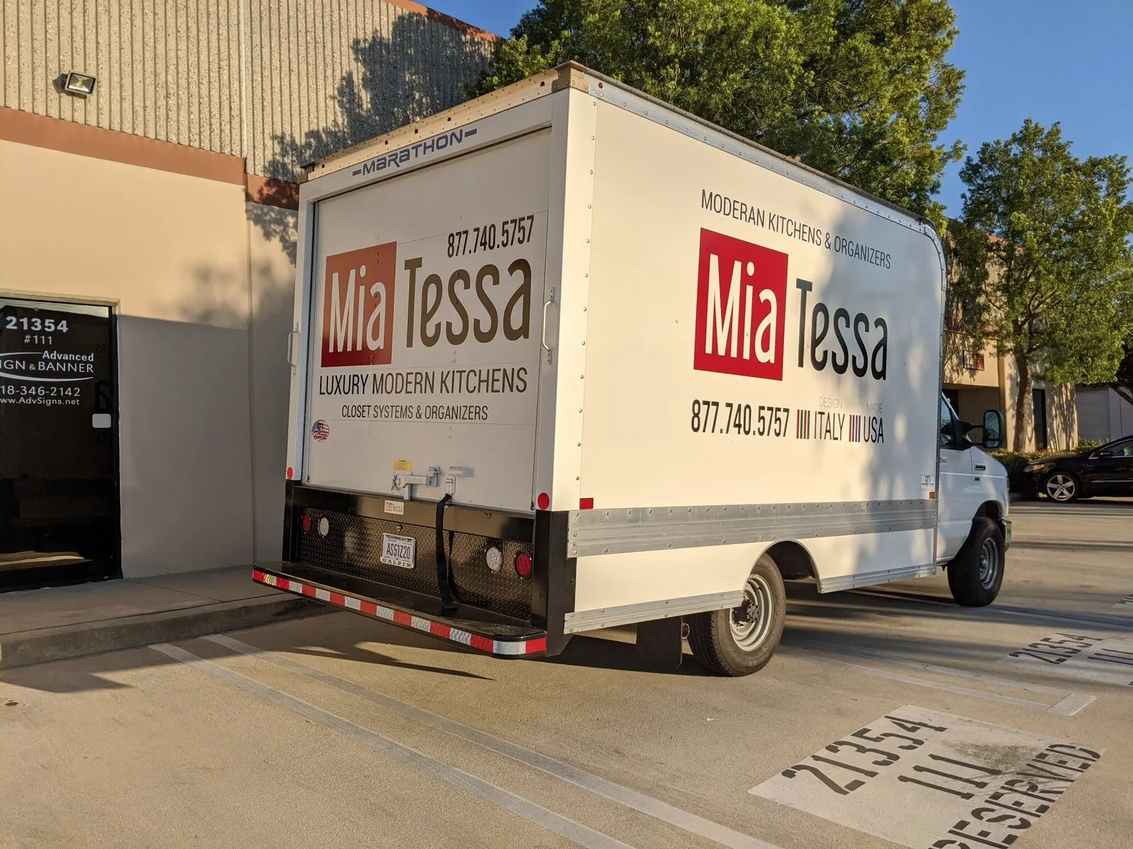 Logo and lettering on a box truck.