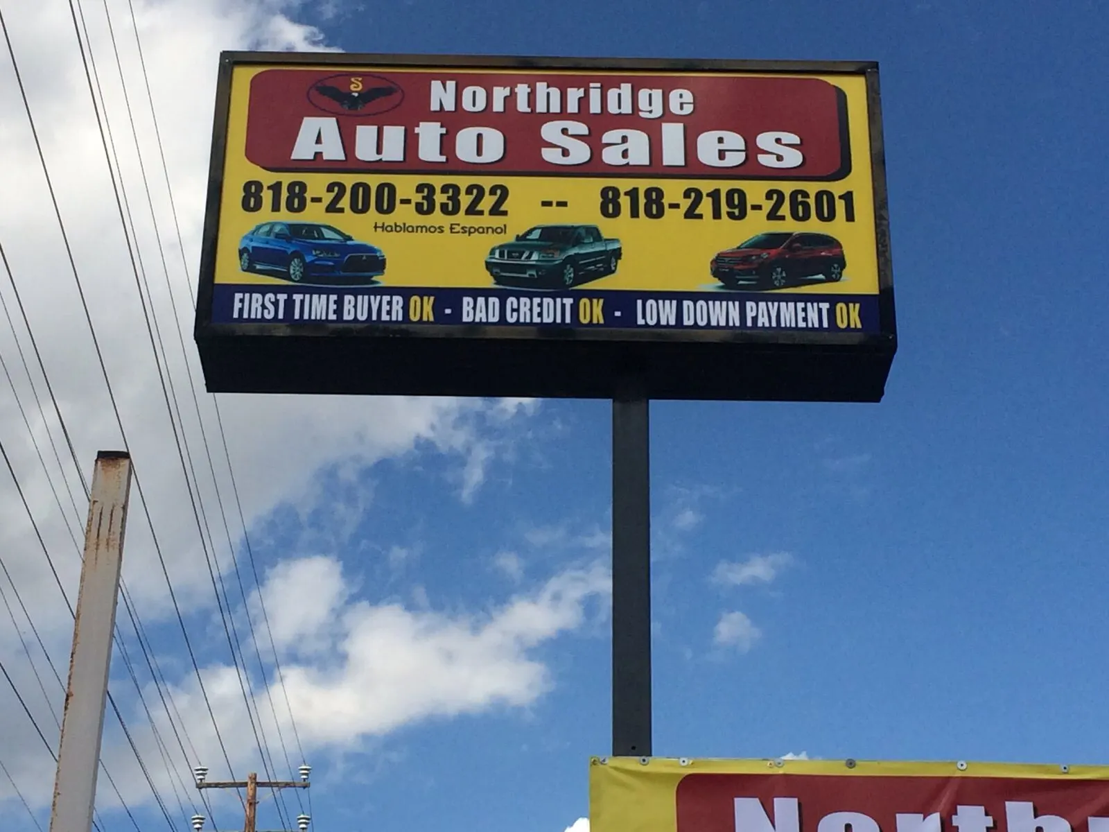 Double-sided pylon sign on a single pole.