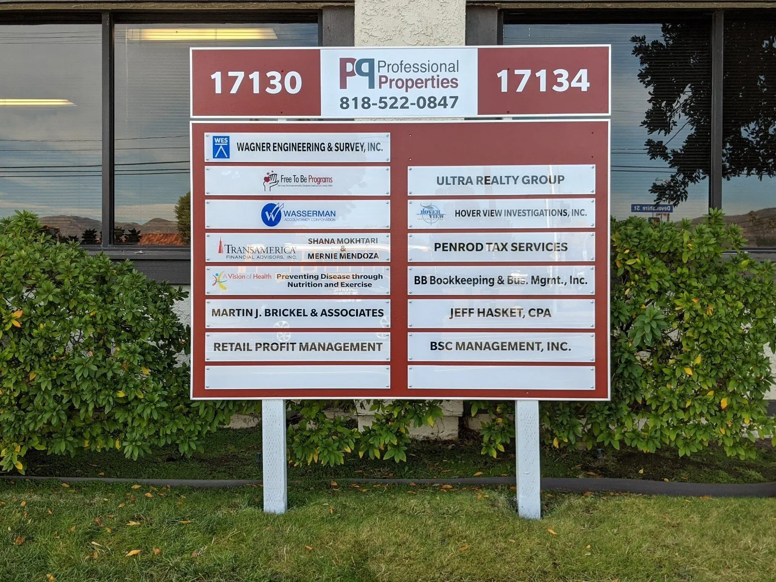 Post-and-panel tenant directory for two buildings.