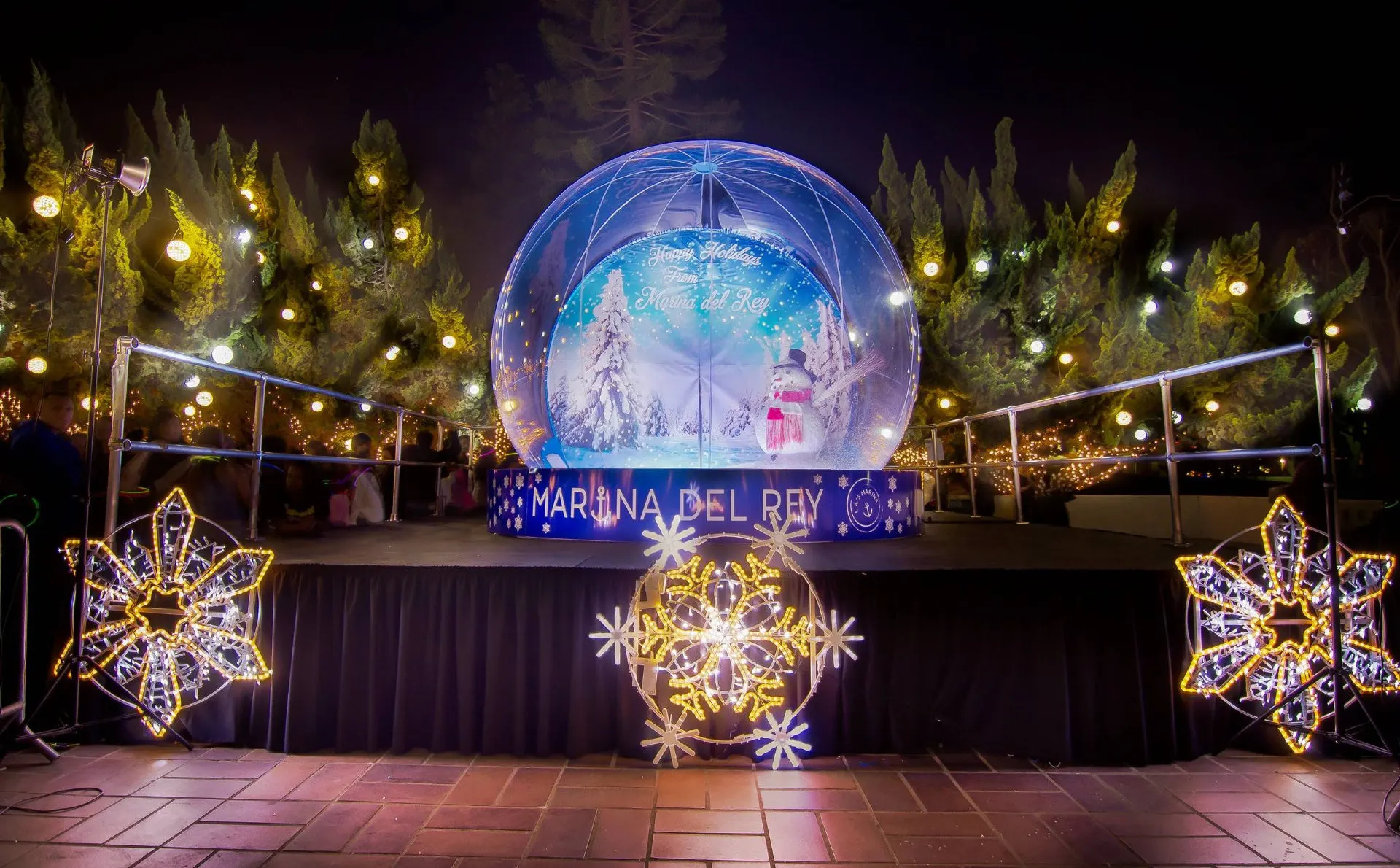 Graphics for a seasonal snow globe installation.