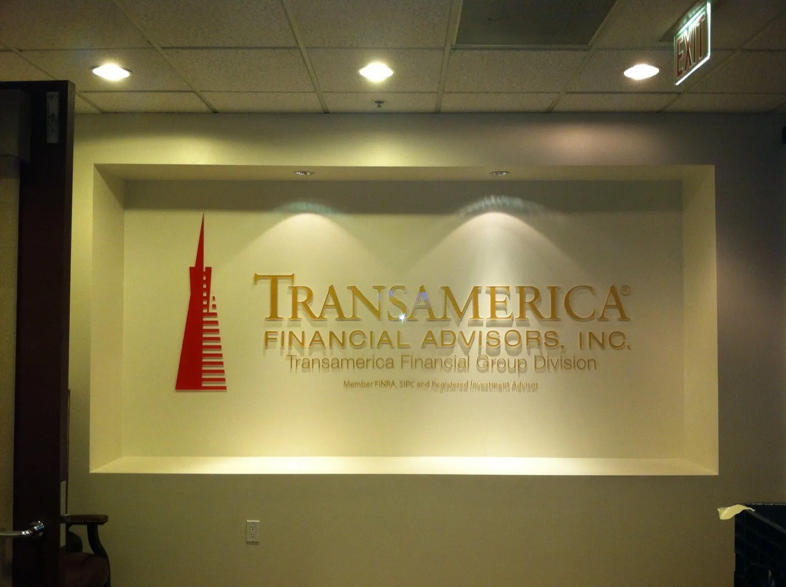 Dimensional logo and letters, lit from above.