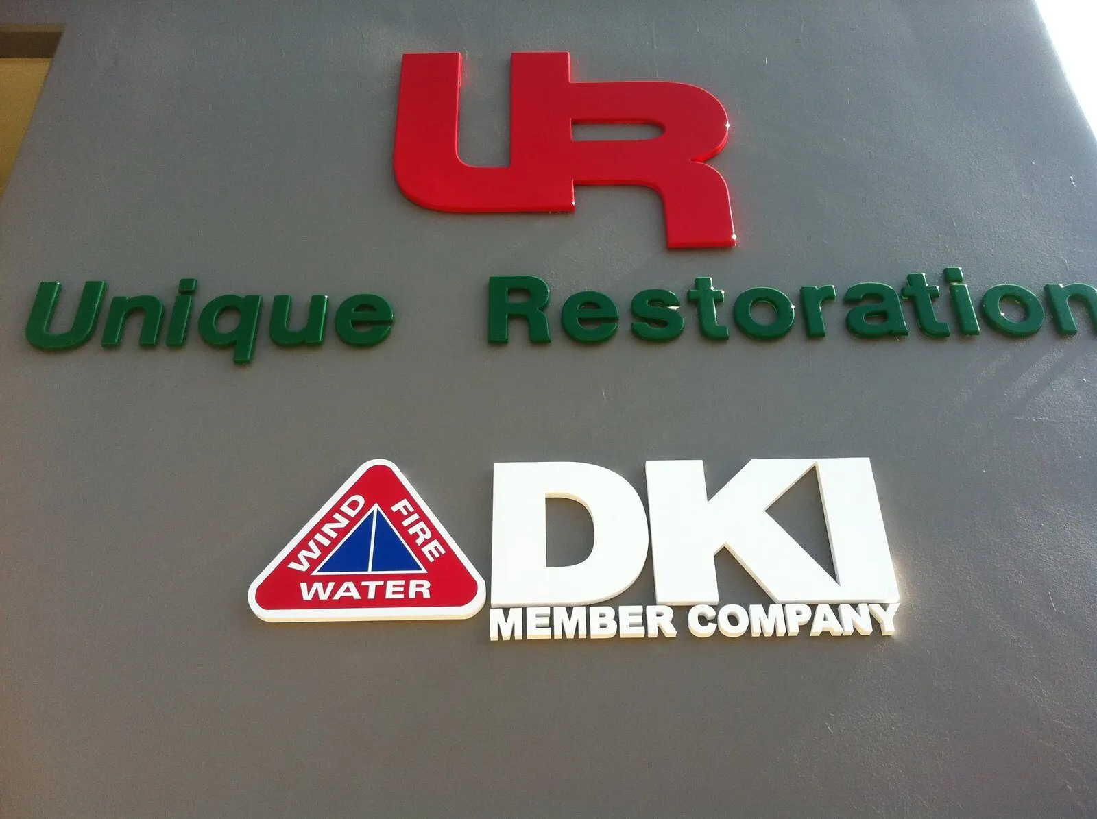 Letters and a DKI member panel over the entrance.