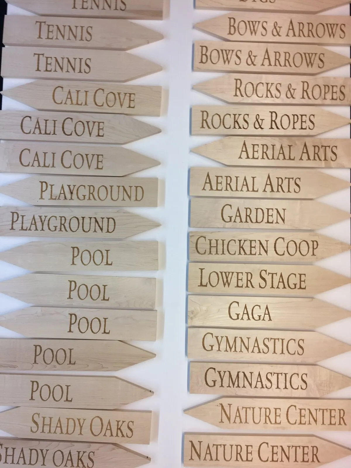 Engraved directional arrows for a camp.