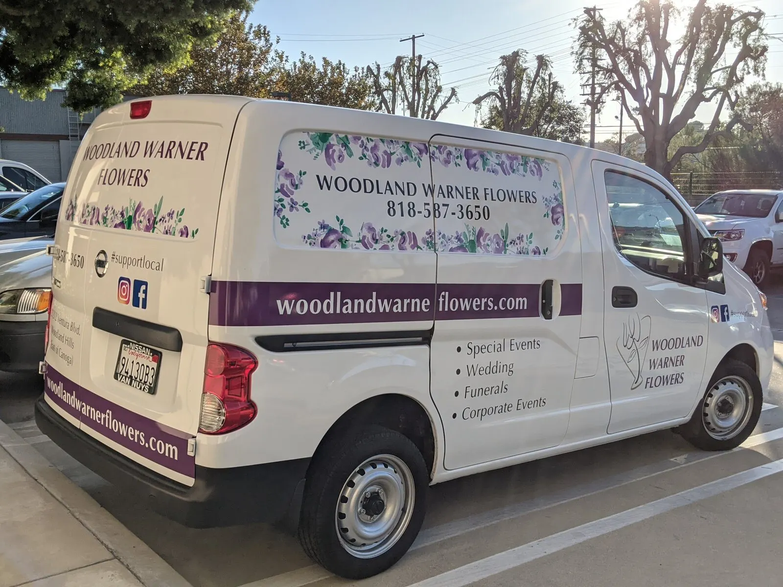 Lettering and graphics on a florist van.
